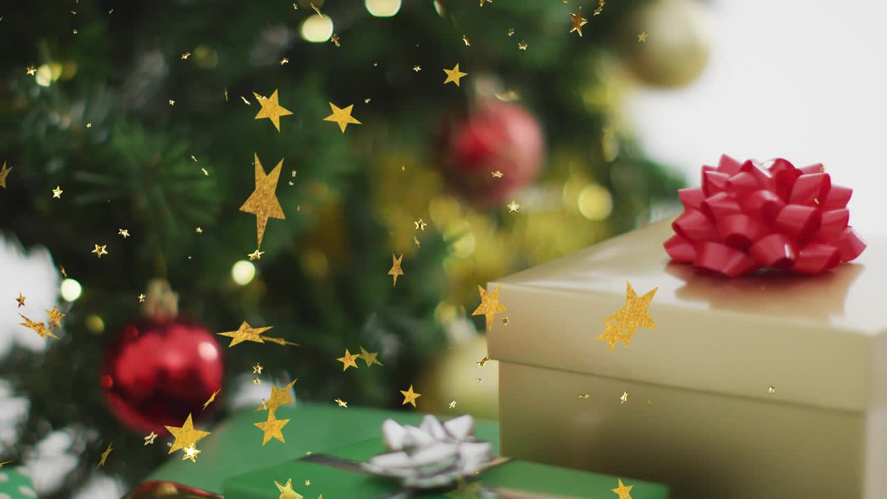 On start gold star confetti drifting past gift boxes while camera shifting revealing Christmas tree