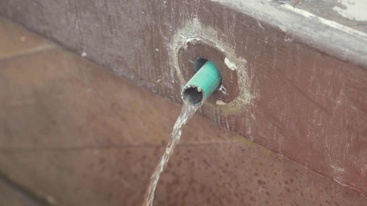 Boat bilge water pumped out of through-hull