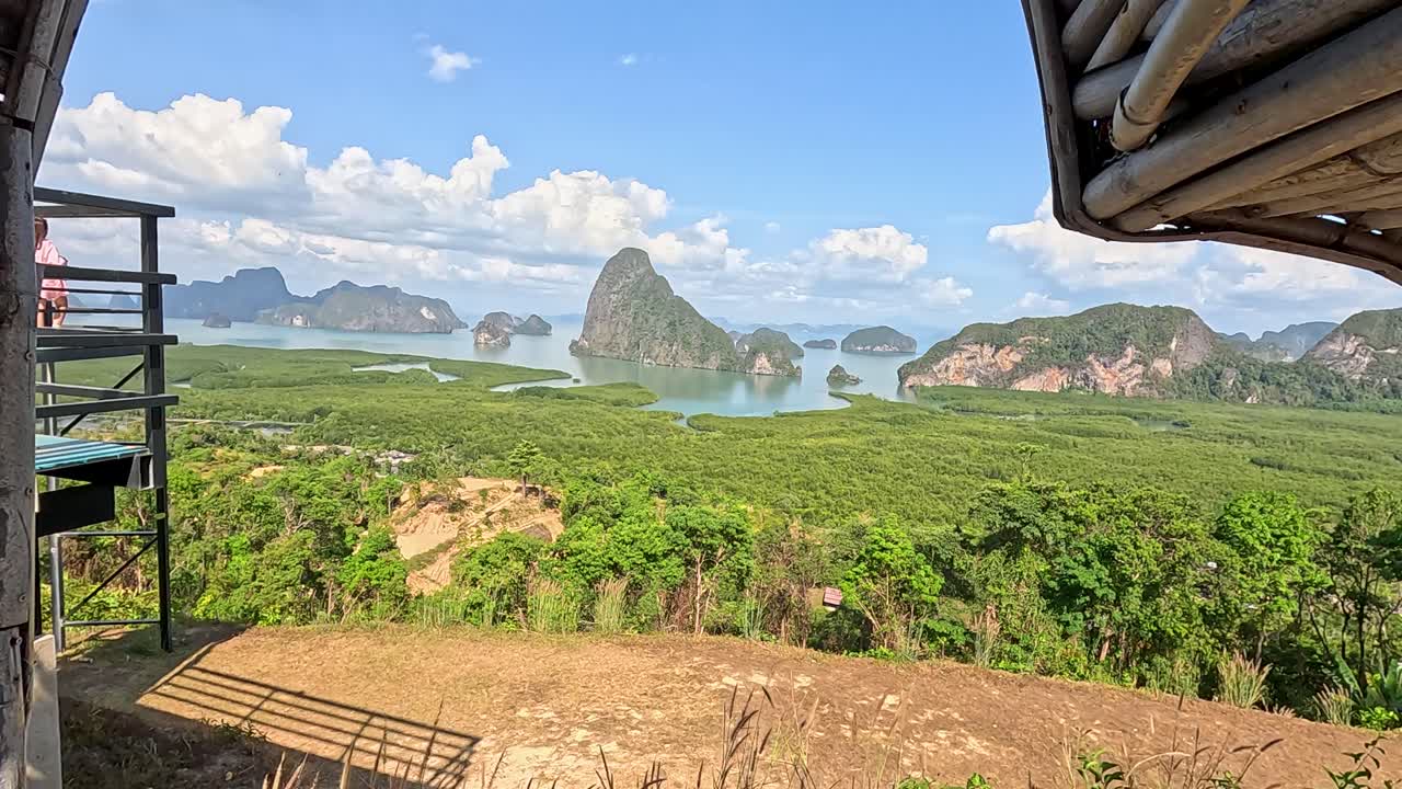 Panoramic view of Phang Nga's lush landscape through a heart-shaped frame, captured in bright daylight with clear skies