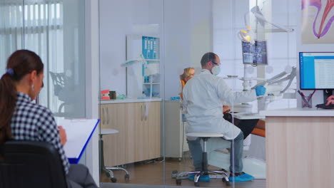 orthodontist lighting the lamp until examination