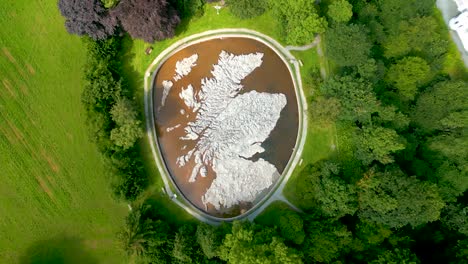 aerial drone slow vertical ascent over the great polish map of scotland at the village of eddleston, scottish borders