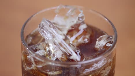 refreshing beverage with ice cubes home setting close-up photography cozy atmosphere captivating experience