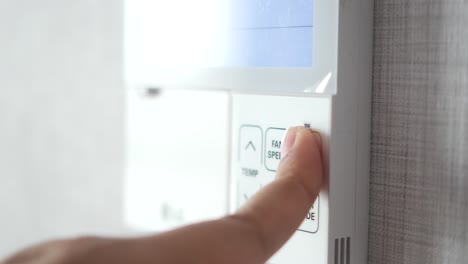 adjusting temperature on smart thermostat