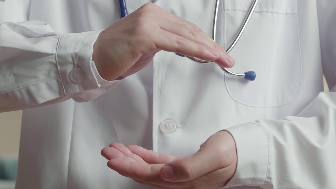 Medical Doctor With Two Hands In Position To Protect Something , Video In 4K