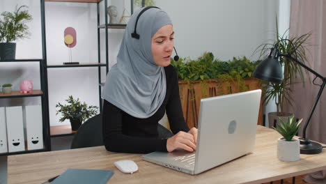 Businesswoman-working-on-laptop-wearing-headset-call-center-support-service-operator-office-helpline