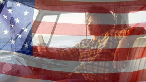 animation of american flag waving over mixed race man on beach by seaside on summer holiday