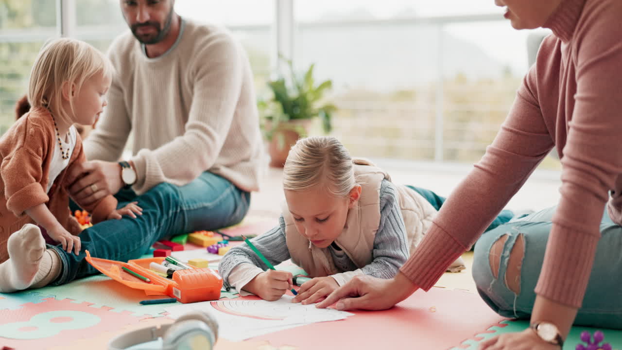 Parents, children and drawing on floor in home