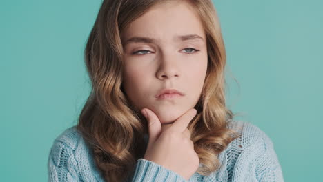 Teenage-Caucasian-girl-thinking-in-front-of-the-camera.