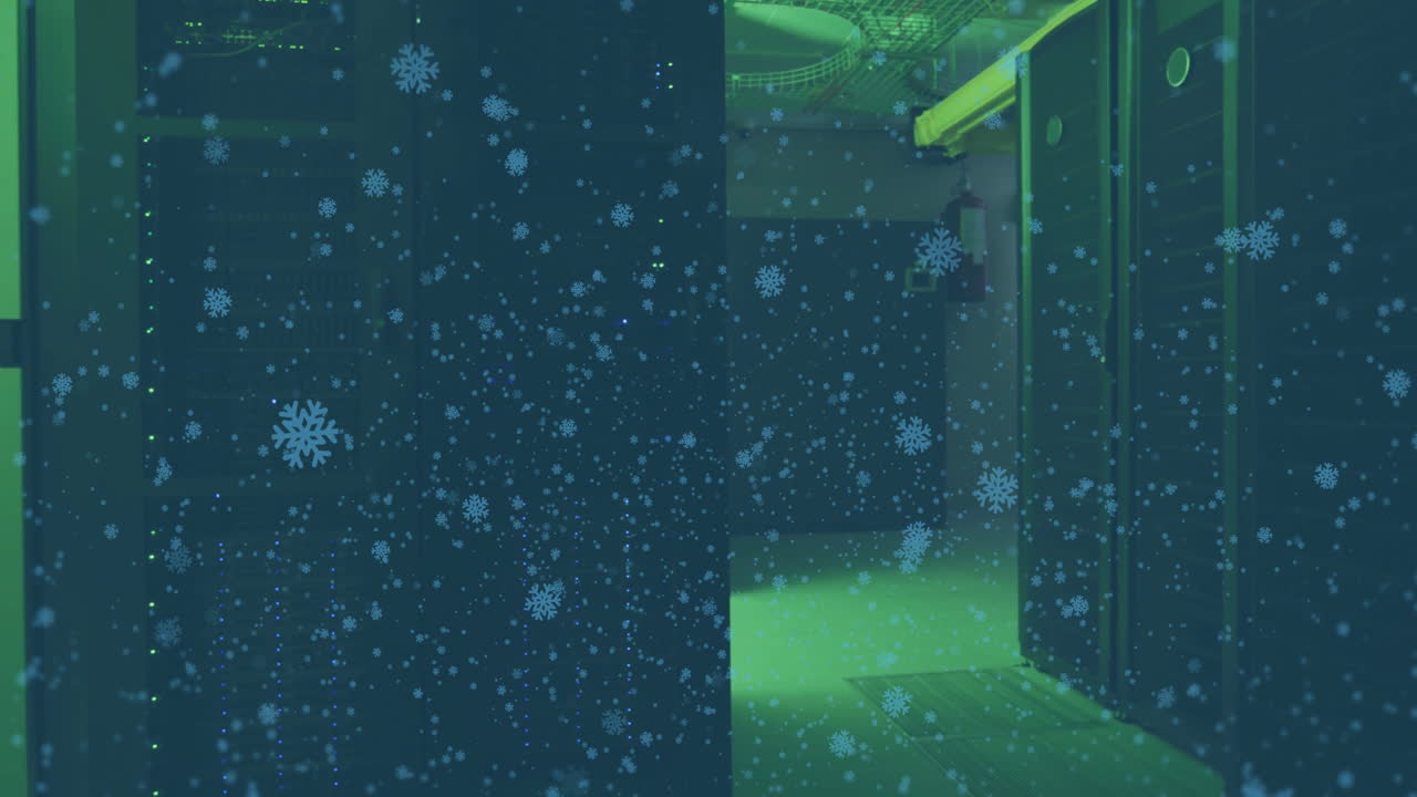 Snowflakes animation over interior view of dimly lit server room