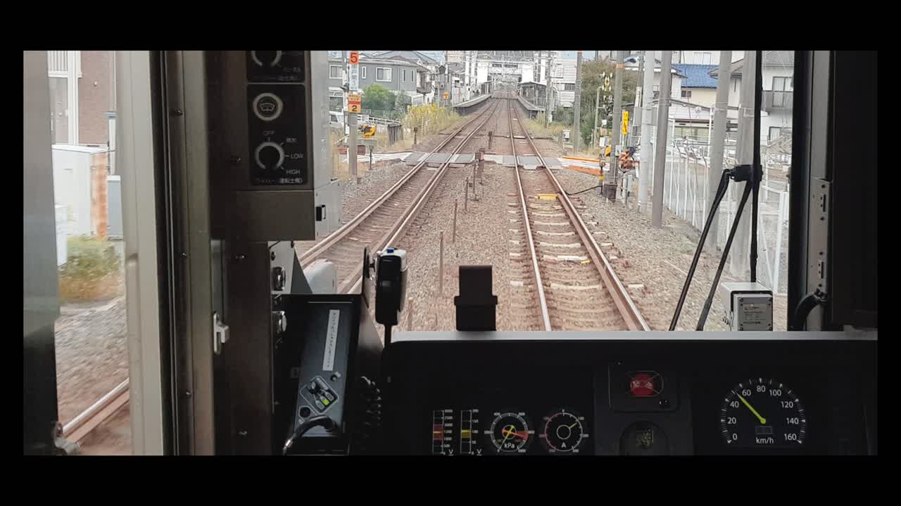 Train ride through the Suburbs of Tokyo. Video of the back of the train through the drivers window.