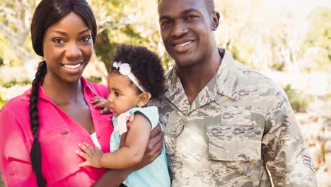 Animation-of-parents-embracing-with-daughter-outdoors