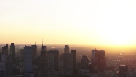 fly forward upward, view of golden hour sunset over warsaw