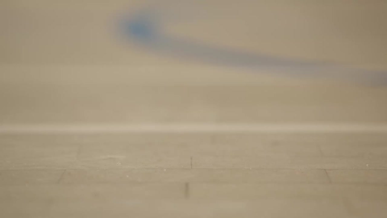 Shuttlecock falling into shot, shallow focus close up