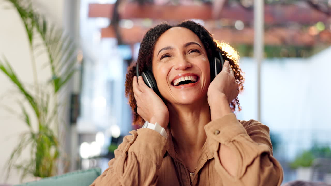 Woman happily listening to music with headphones