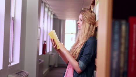 beautiful student reading a book