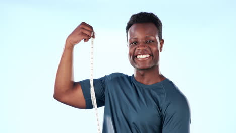 Black-man,-bodybuilder-measuring-muscle