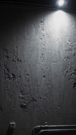 textured wall with overhead light
