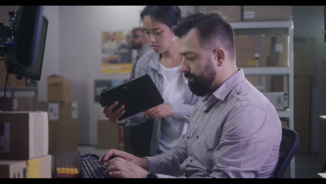 warehouse workers collaborating on inventory management