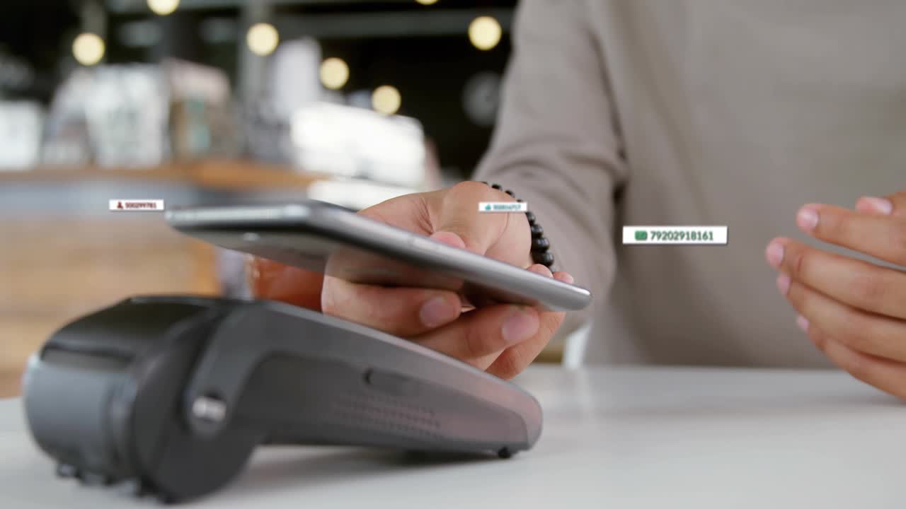 Man holding phone tapping while UI labels appearing lifting phone processing contactless payment