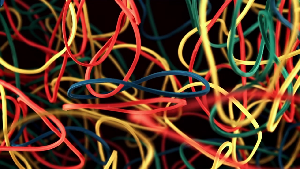Close-Up of Colorful Rubber Bands Racking Focus on Black Background