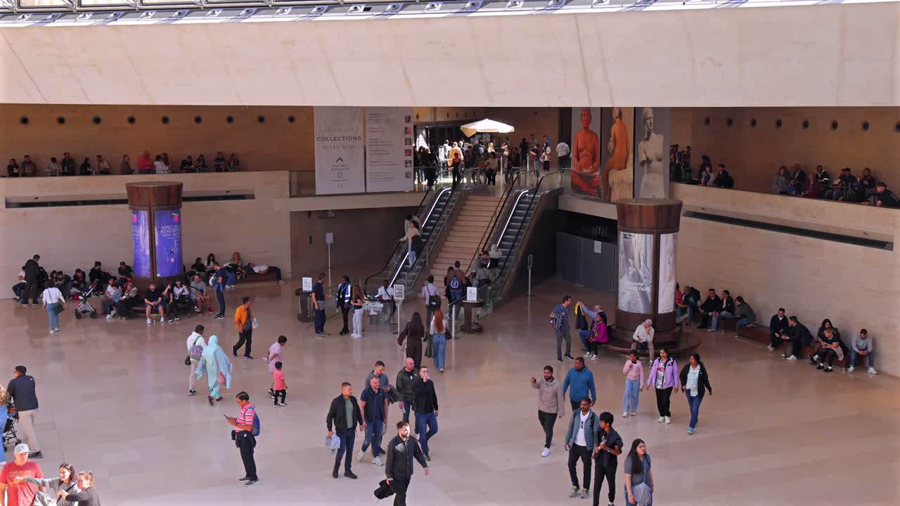 Crowded Interior of the Louvre Museum in Paris