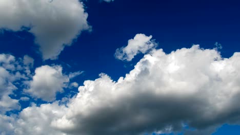 clouds are moving in the blue sky. timelapse