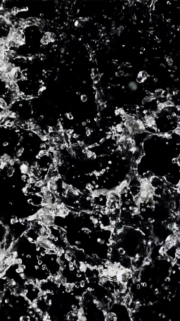 Slow Motion Clear Water Splashing on Black Background