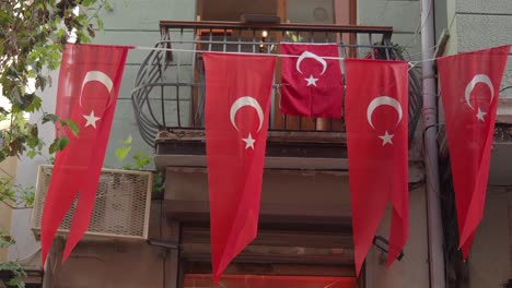 turkish flags hanging from balcony