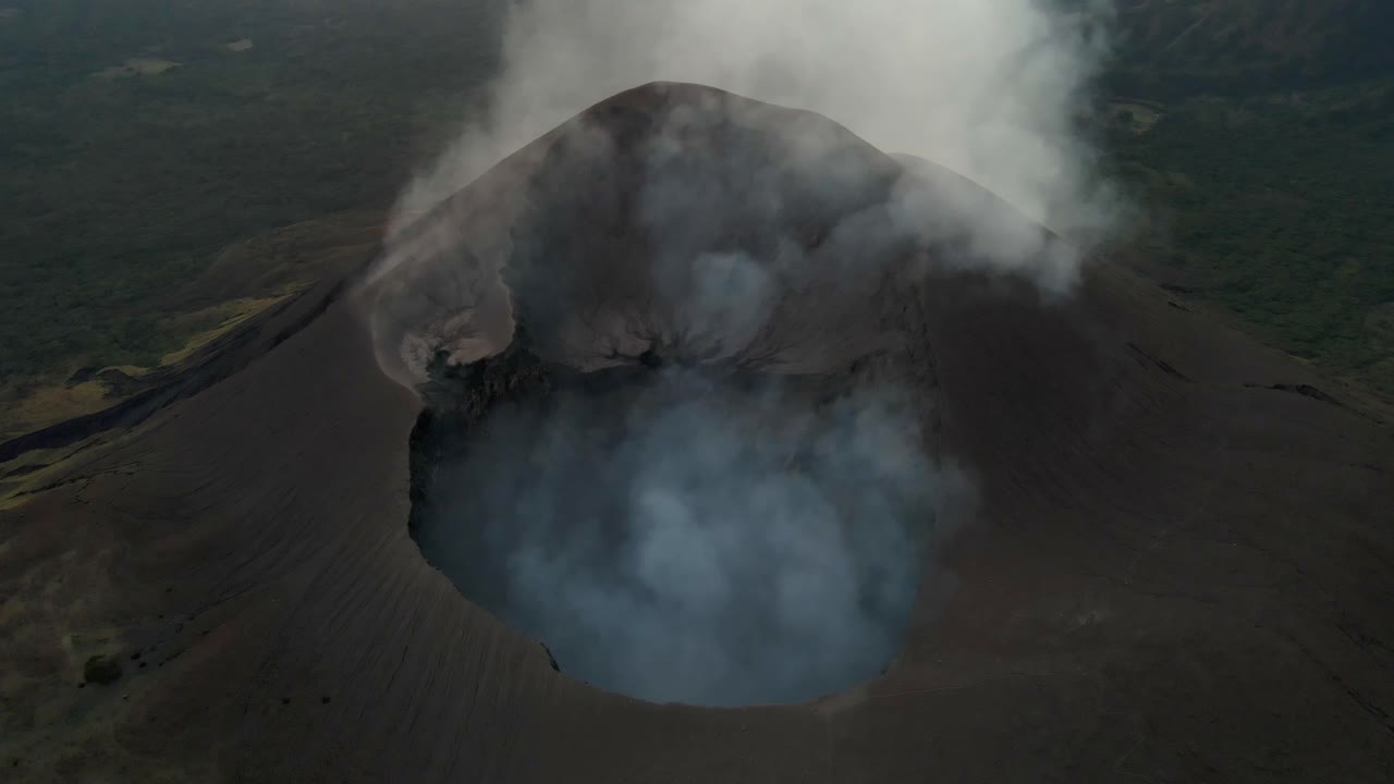 Nicaragua active volcano Telica crater hot surface steam coming out, aerial view