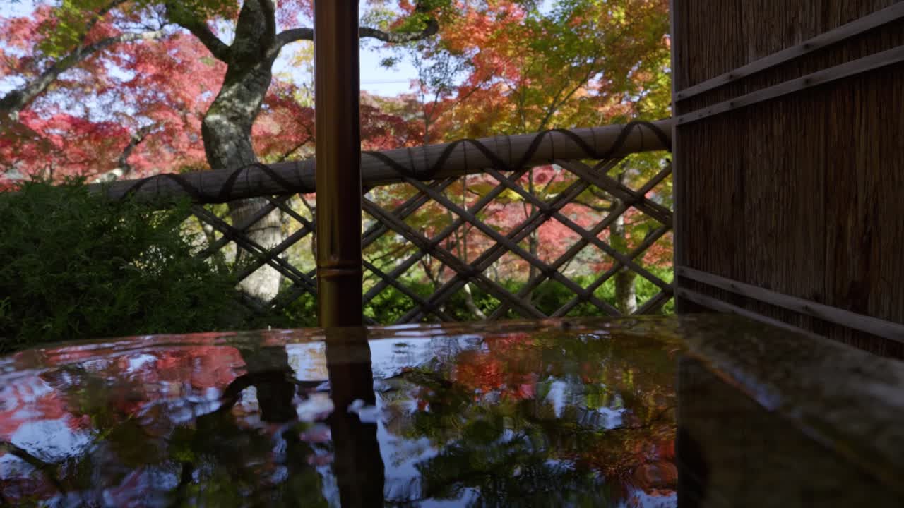 Slow motion slider over autumn color reflections in Japan