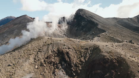 volcanic landscape with steam and crater lakes