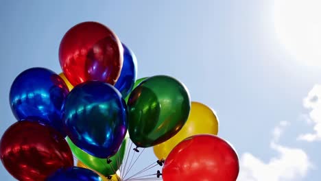 colorful balloons against a clear blue sky