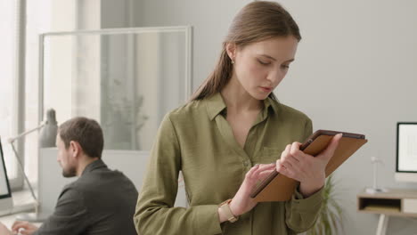 businesswoman writting something on notebook in the office