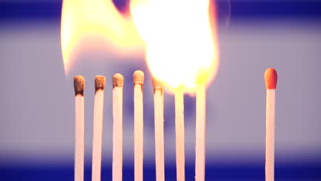 coronavirus outbreak, social distancing in israel. concept: spreading epidemic, domino effect, covid-19, isolated burning matches, stop spreading virus, keep quarantine, lockdown