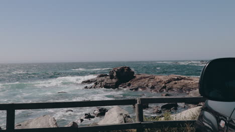 Amazing-view-from-side-of-parked-car-onto-rocky-Atlantic-coast-in-Spain