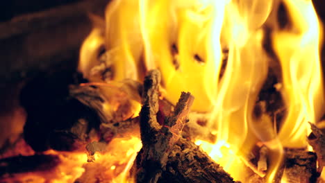 Closeup-tracking-shot-of-campfire-burning-brightly