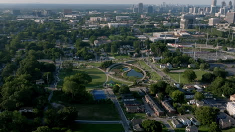 Aerial view of Atlanta park with circular pond and winding paths, surrounded by neighborhoods