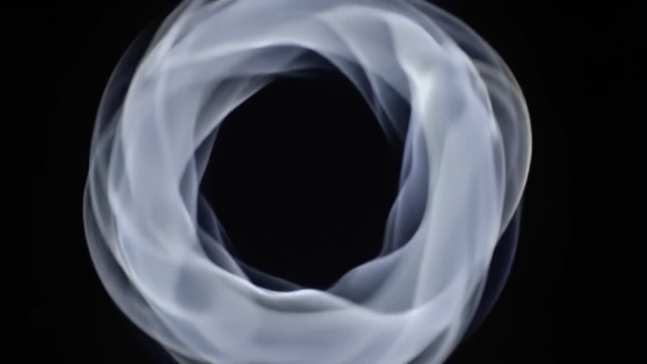 An Ethereal Exploration of Transitions: Captivating Swirls Emerge from Dark Stillness in a Unique Visual Journey