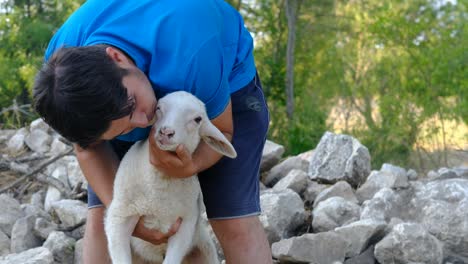 man kissing lamb