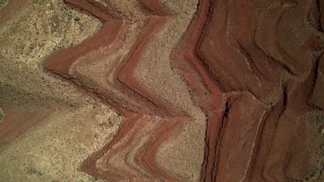 drone aerial cinematic shot of a detailed texture of the abstract patterns in the desert dunes of antelope mountain