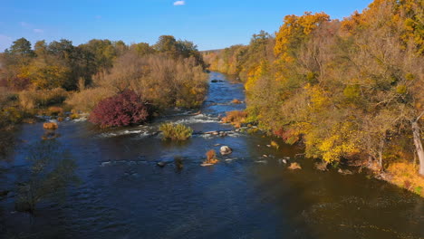 autumn nature. amazing scenery background. river in the forest. calm lake surrounded by autumn trees. aerial view
