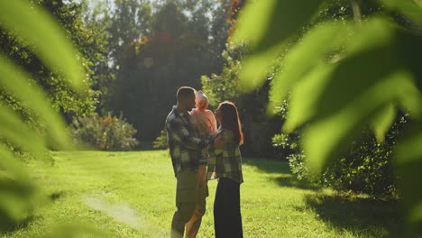family enjoying a sunny day in the park