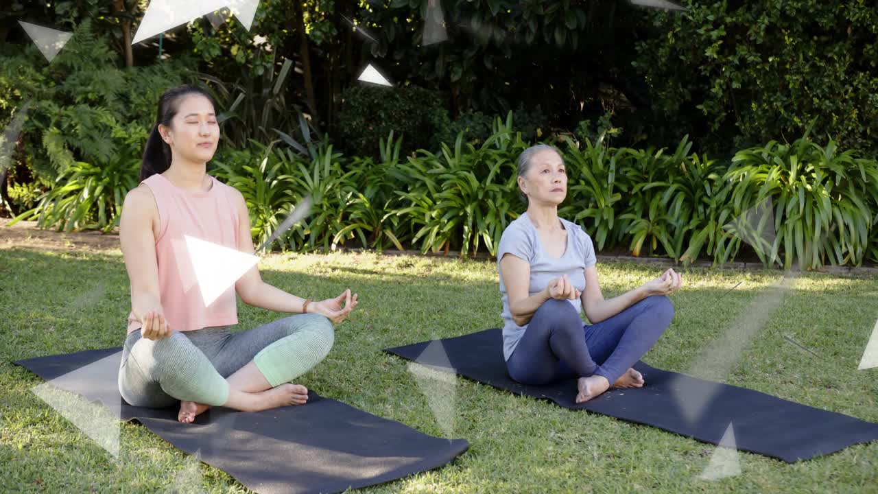 Mid adult initiating arm flow senior woman following forming yoga mudra overlays crossing centering