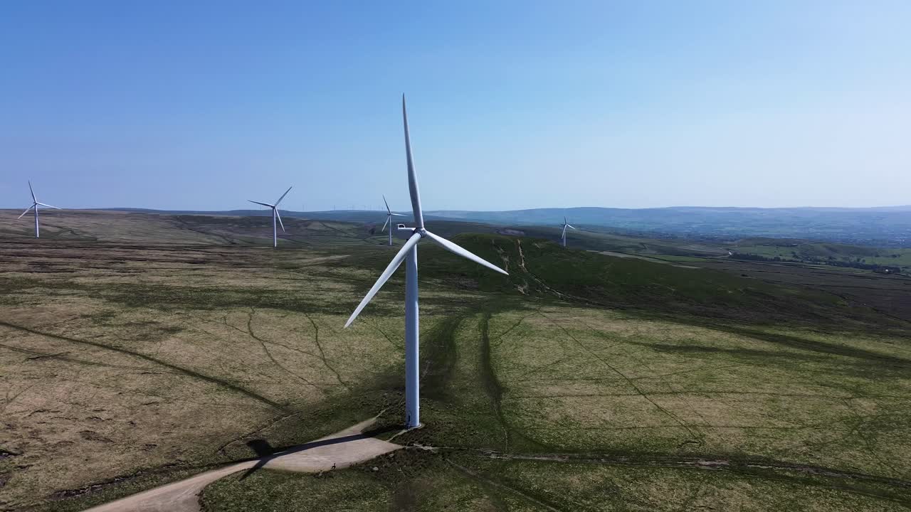 Aerial view of wind turbines farm to produce clean renewable sustainable energy target netzero
