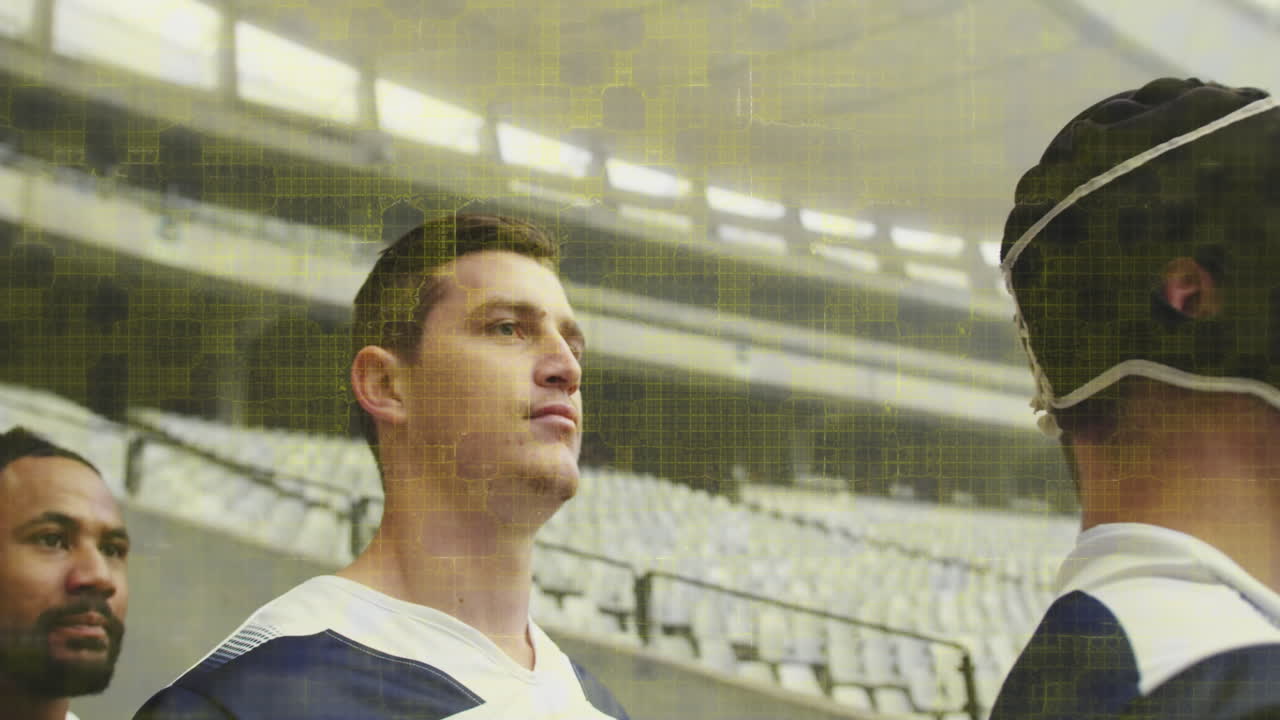 Animazione di quadrati colorati su giocatori di rugby maschi allo stadio.