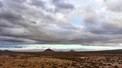 dramatic clouds over the mojave desert after a rainstorm - aerial flyover