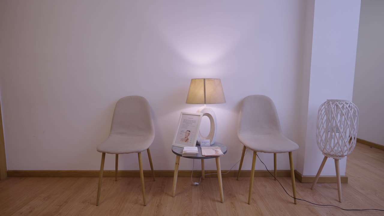 Empty waiting room with chairs and lamp