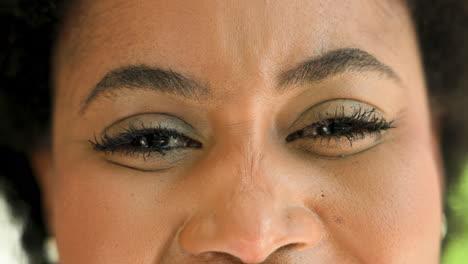 close-up of woman's eyes with natural makeup, showing warmth and joy