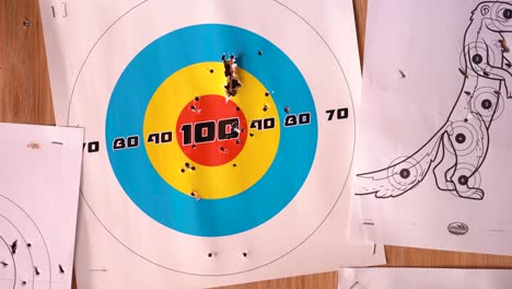 A-man-looking-at-shooting-target-results