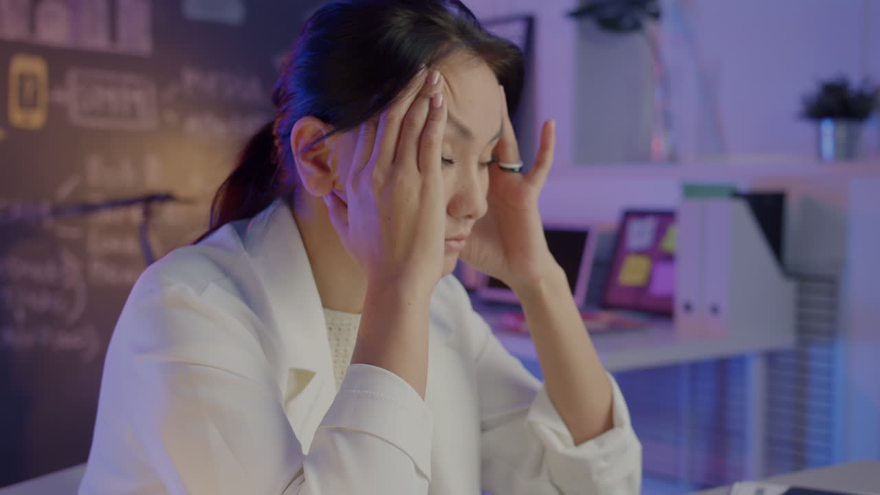 Woman Experiencing Stress at Work